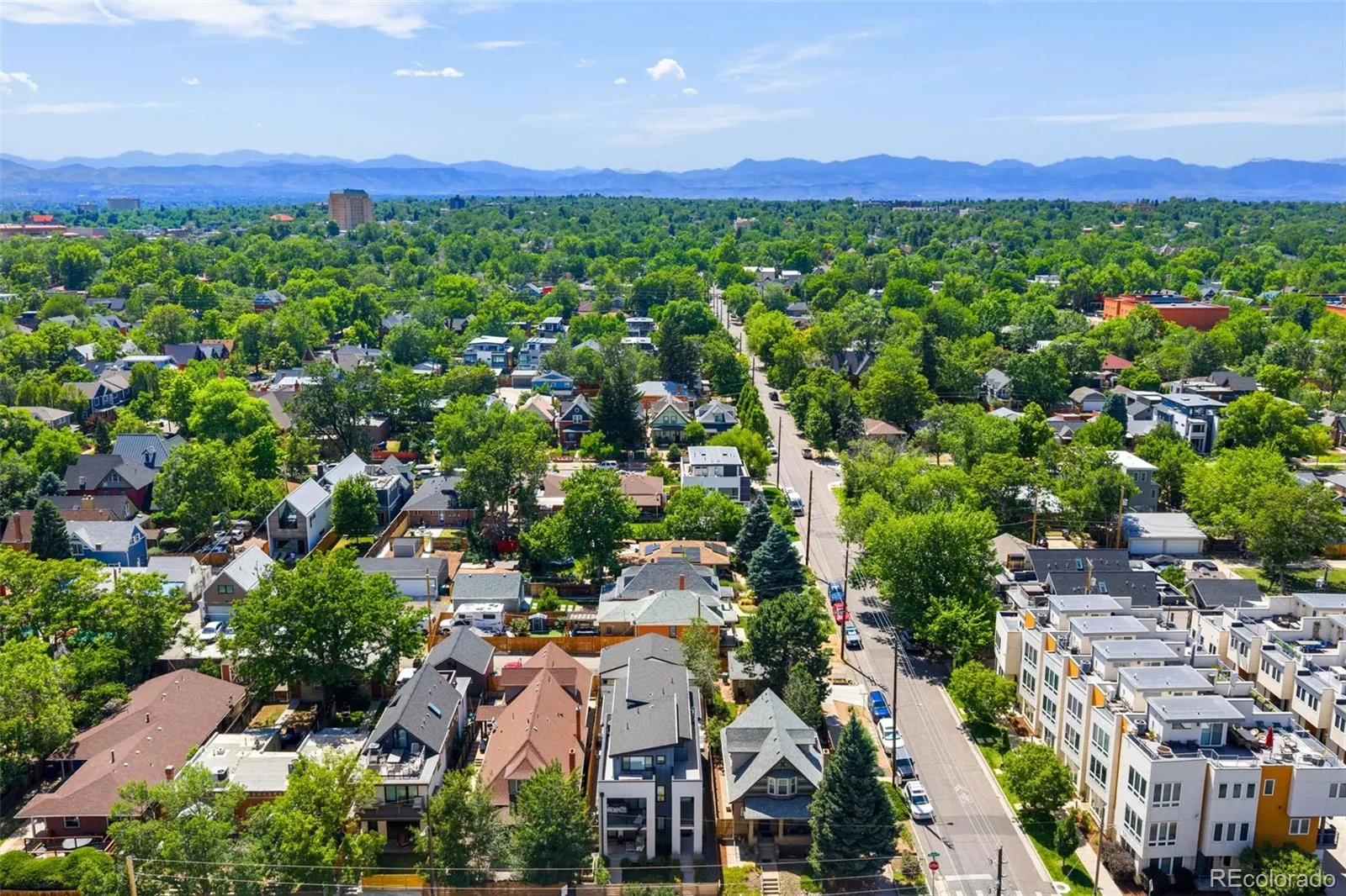 Aerial view of the 3451 Tejon Street block with the mountains beyond