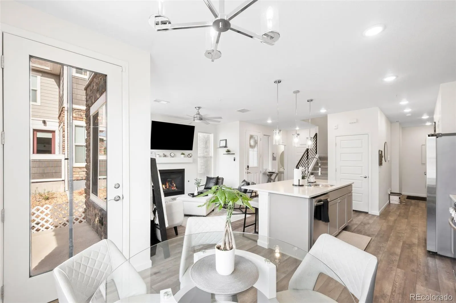 Dining table, kitchen island and fireplace at 23728 E Ida Drive